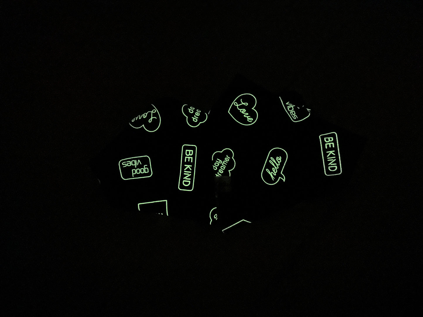 The "Cotton Pet Bow with collar attachment - Glow in the dark Signs" by Crafts by Kate features glow-in-the-dark phrases like "Be Kind," "hello," and "LOVE" in various fonts and speech bubbles.